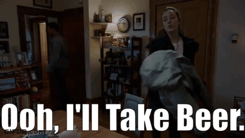 Woman In Living Room Saying Ooh I'll Take Beer GIF