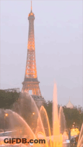 Woman In Long Black Dress With Gold Necklace GIF