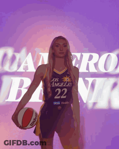 Woman In Los Angeles Basketball Uniform Holding Basketball GIF