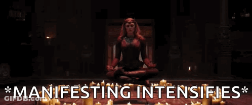 Woman In Lotus Position Surrounded By Candles Manifesting Intensifies GIF