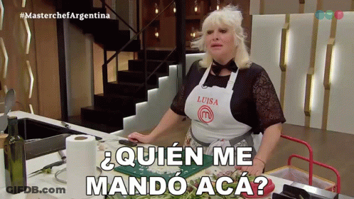 Woman In Luisa Apron At Kitchen Counter GIF