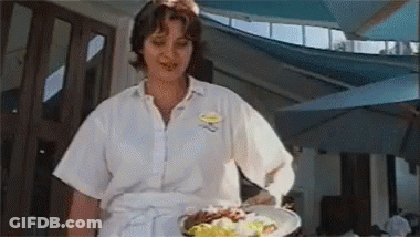 Woman In Maid Costume Standing Before Crowd GIF
