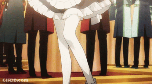 Woman In Maid Costume Standing In Crowd GIF