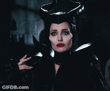 Woman In Maleficent Costume Holding Knife GIF
