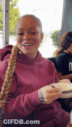 Woman In Maroon Hoodie Holding Coffee GIF