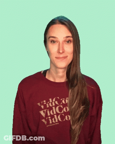 Woman In Maroon Vidco Shirt GIF