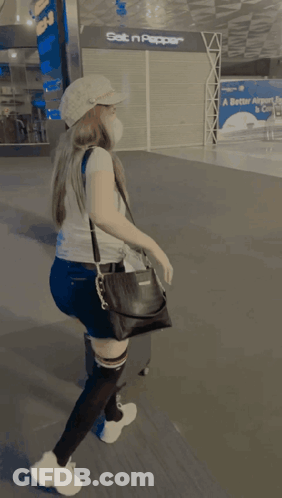 Woman In Mask And Levi's Shirt At Set N Pepper Store GIF