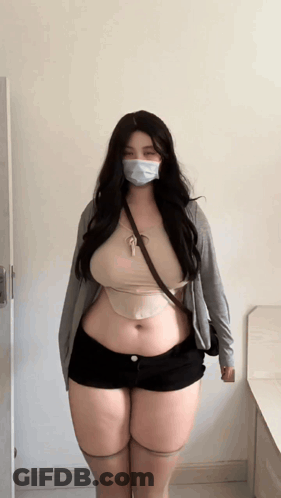 Woman In Mask And Shorts GIF