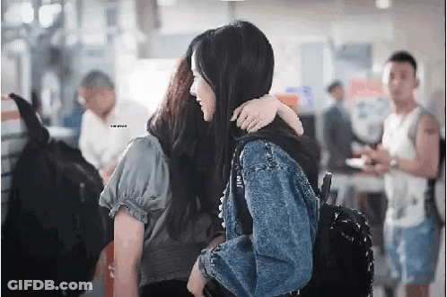 Woman In Mask And White Shirt Saying M & C GIF