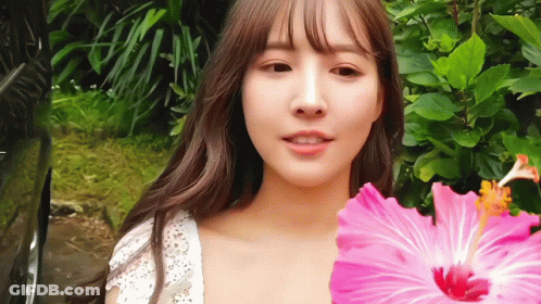 Woman In Mask Holding Book In Front Of Moot Sign GIF