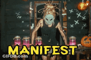 Woman In Mask In Front Of Jars With Manifest In Yellow GIF