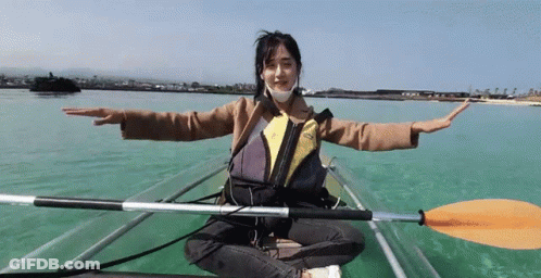 Woman In Mask Sitting In Clear Kayak GIF