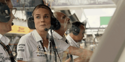 Woman In Mercedes Shirt Talking Into Headset GIF