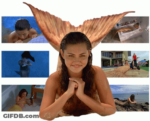 Woman In Mermaid Costume Surrounded By Mermaids GIF