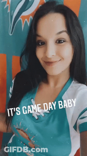 Woman In Miami Dolphins Shirt Smiling GIF