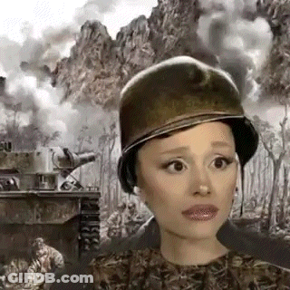 Woman In Military Helmet Standing In Front Of Tank GIF