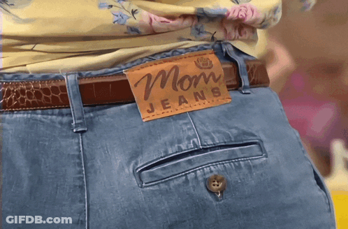 Woman In Mom Jeans With Brown Leather Tag GIF
