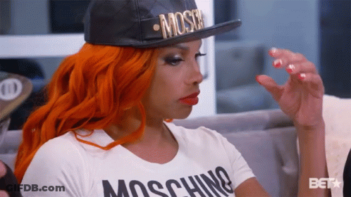 Woman In Moschino Hat And White Shirt GIF