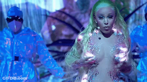 Woman In Naked Dress In Front Of Blue Jackets GIF
