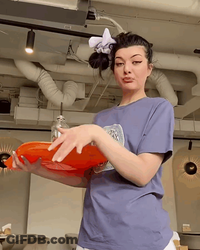 Woman In NASA T-Shirt Holding Orange Tray GIF