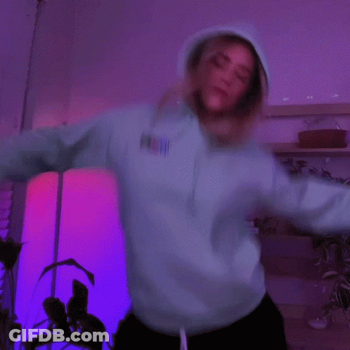 Woman In Neon Green Hoodie Dancing GIF