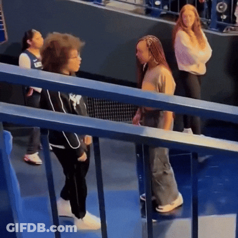 Woman In Nike Shirt Next To Girl GIF