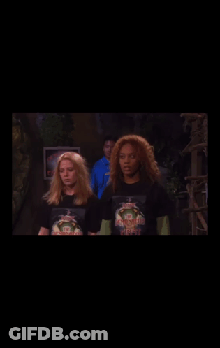 Woman In Ninja Turtles T-Shirt Next To Another Woman GIF
