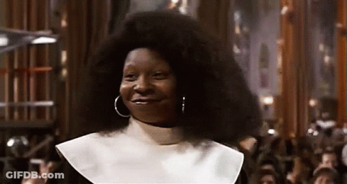 Woman In Nun Costume Smiling At Crowd GIF