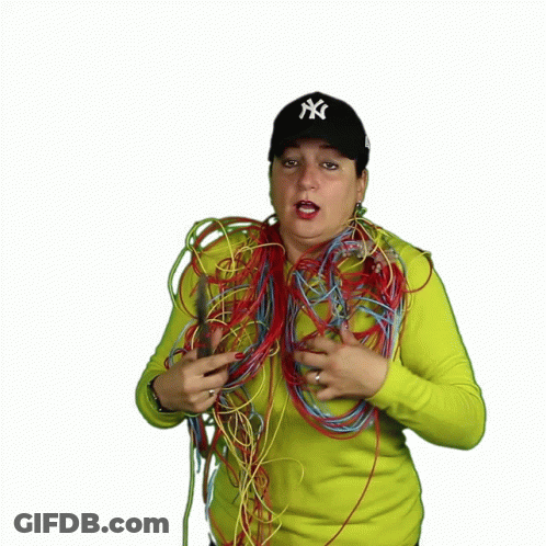 Woman In NY Hat Holding Pliers And Wires GIF