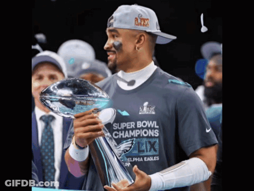 Woman In NY Hat On Man's Shoulders GIF