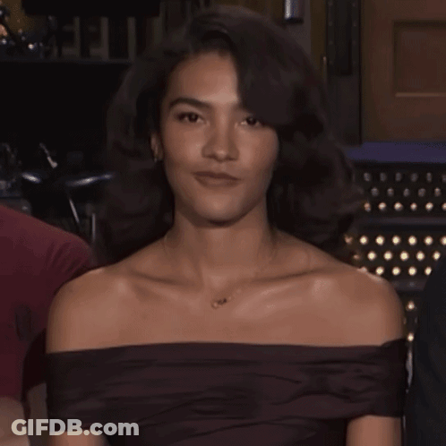 Woman In Off-Shoulder Top With O Necklace GIF