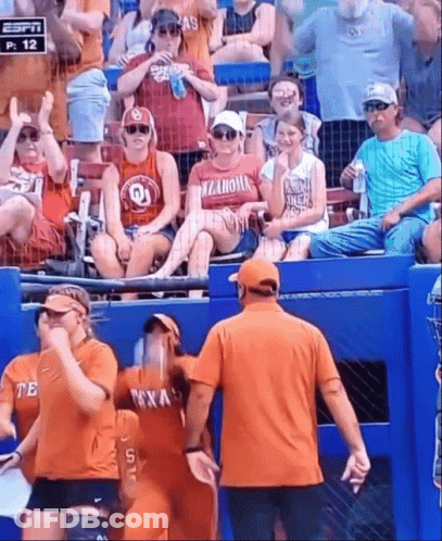 Woman In Oklahoma Shirt Standing In Stands GIF
