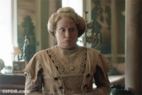 Woman In Old Fashioned Dress Making Face GIF