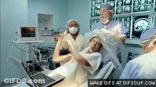 Woman In Operating Room With Laptop GIF