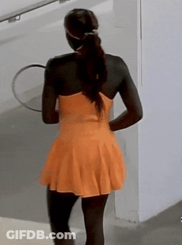 Woman In Orange Dress Holding Tennis Racquet GIF