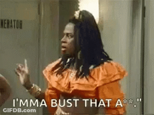 Woman In Orange Dress Saying I'ma Bust That A** GIF