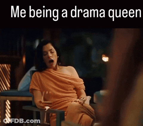 Woman In Orange Dress Yawning With Glass Of Wine GIF
