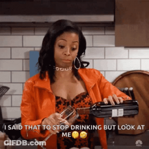 Woman In Orange Jacket Pouring Wine Into Glass GIF