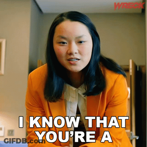 Woman In Orange Jacket Says I Know That You're A GIF