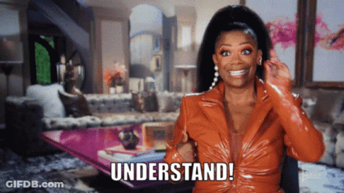 Woman In Orange Jacket Says Understand GIF