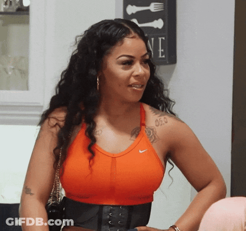 Woman In Orange Nike Tank Top Saying One GIF