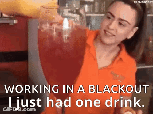 Woman In Orange Shirt Pouring Drink Into Glass GIF