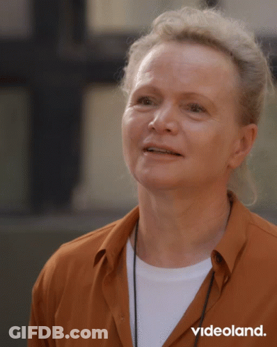 Woman In Orange Shirt With Videoland Text GIF
