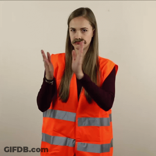 Woman In Orange Vest Clapping GIF