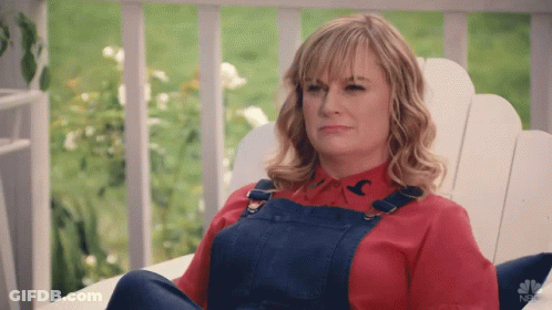 Woman In Overalls And Red Shirt With Bird GIF