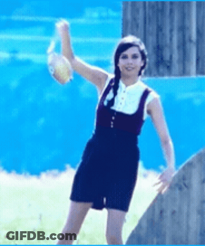 Woman In Overalls Throwing Ball GIF