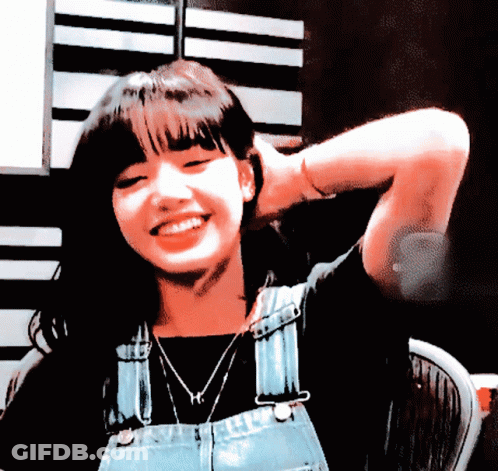 Woman In Overalls With H Necklace GIF