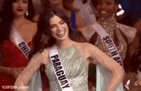 Woman In Paraguay Sash Smiling With Others GIF