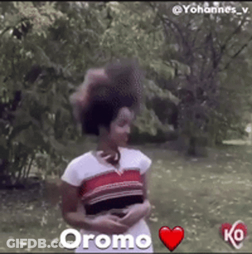Woman In Park With Red Heart Saying Oromo GIF