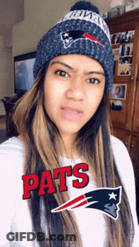 Woman In Patriots Beanie And White Shirt GIF